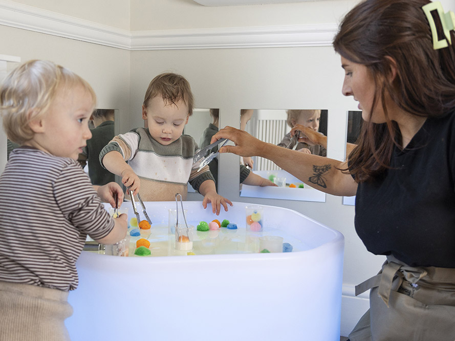 Children playing with water toys in the baby and toddler suitesuite
