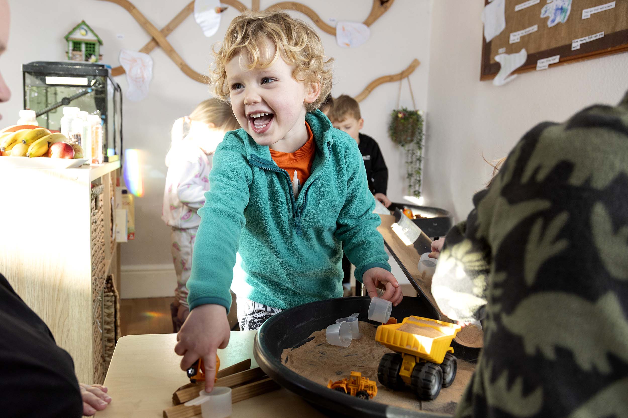 A child playing happily at playaway nursery in the pre-school suite 